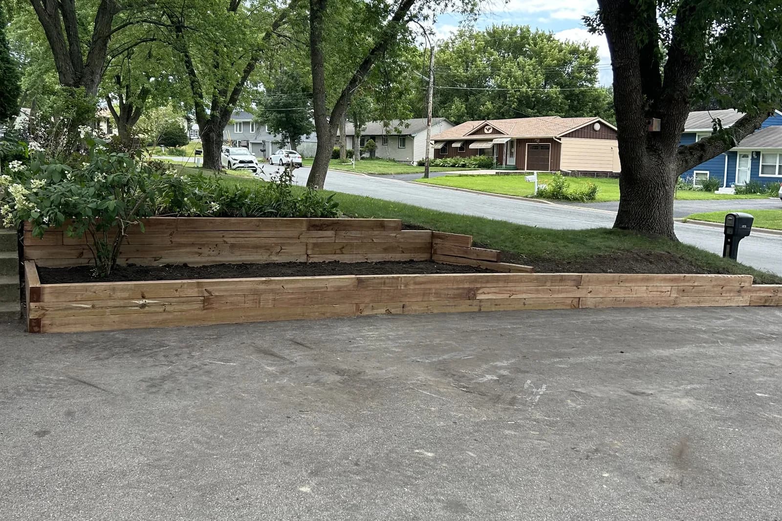 Finished timber retaining wall, rebuilt square and level