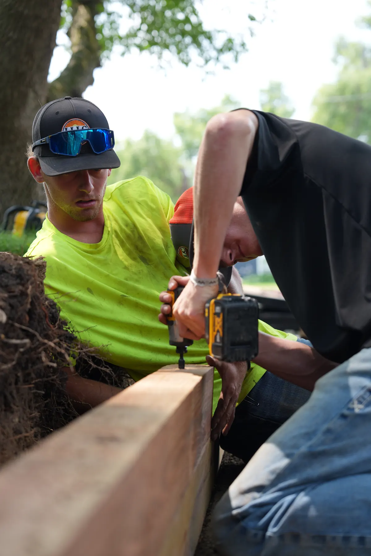 Lofton crew members preparing a rock bed installation