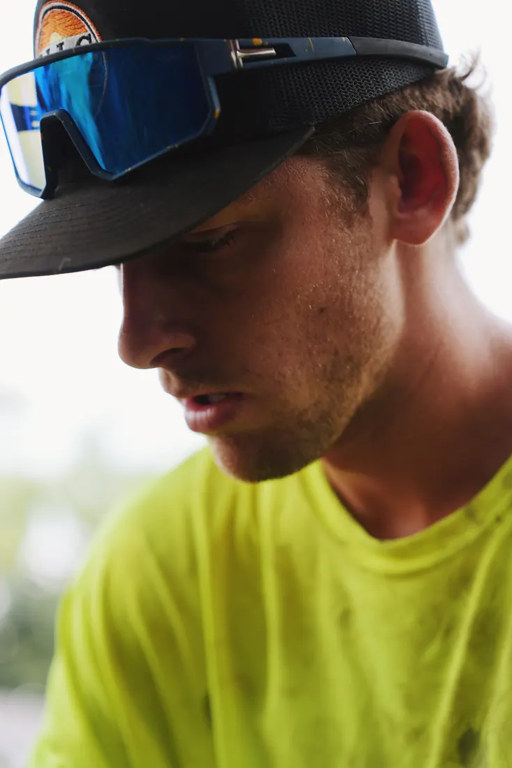 Lofton crew member in the lime uniform on site