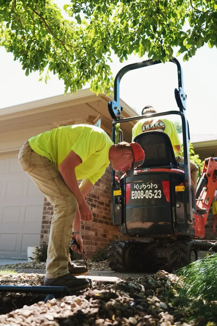 Lofton crew compacting a bed with the roller