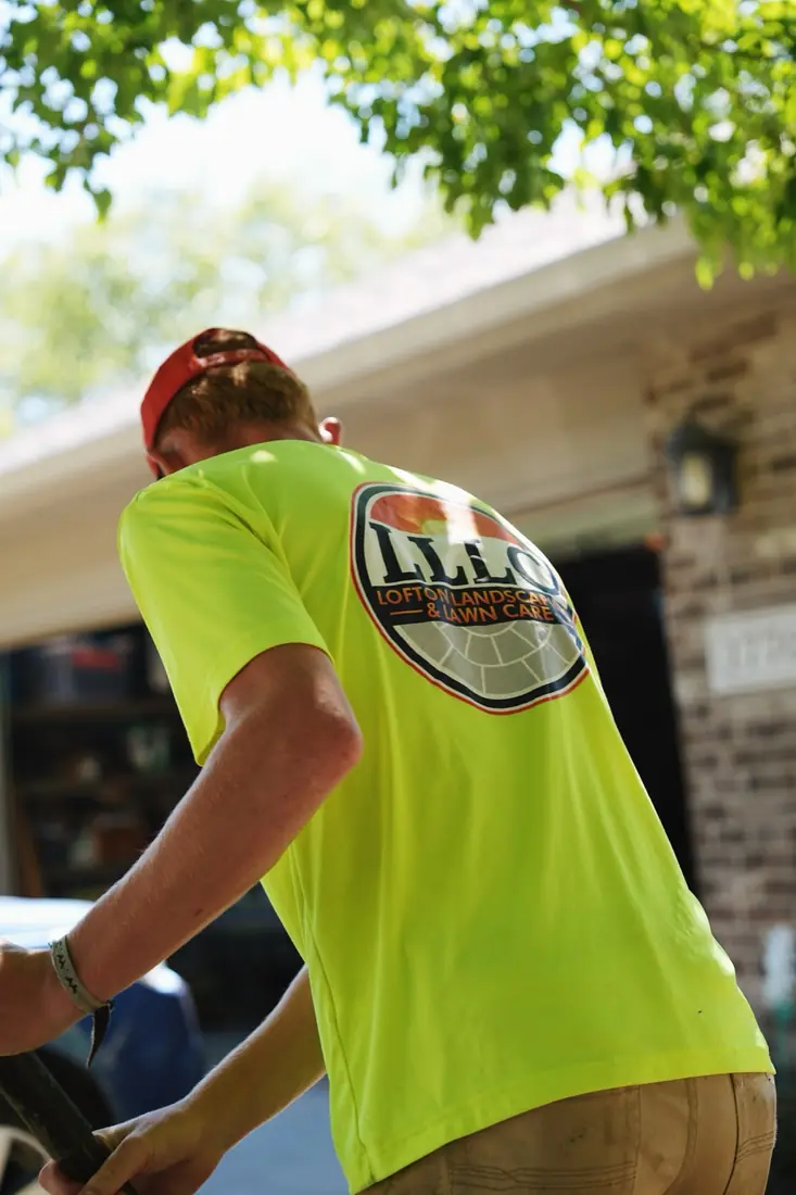 LLLC crew member in uniform working a bed