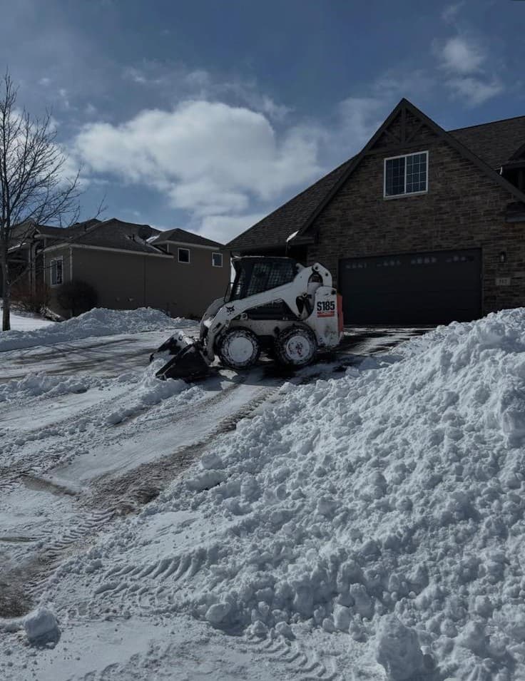Driveway and sidewalk snow clearing by Lofton Landscaping